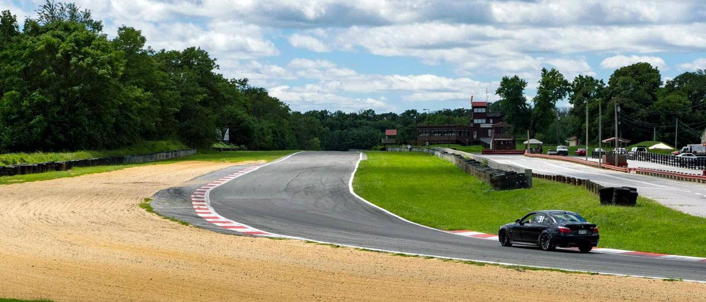 Race car rounding a corner at Summit Point Motorsports Park in West Virginia. Photo courtesy of Summit Point Motorsports Park, Facebook