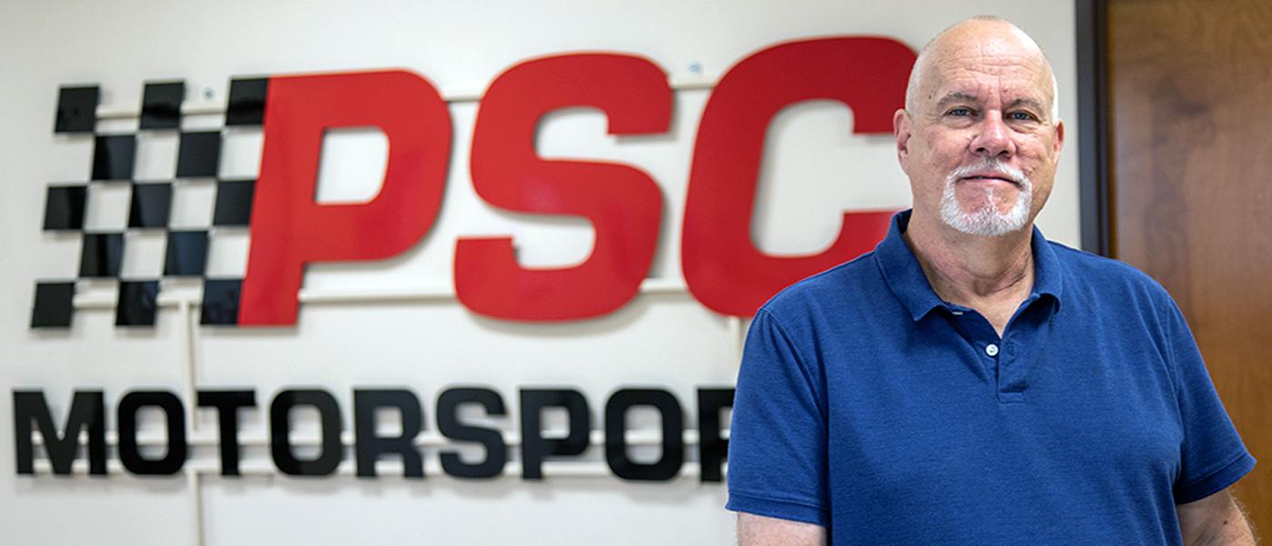 Robert Sager standing in front of PSC Motorsports signage