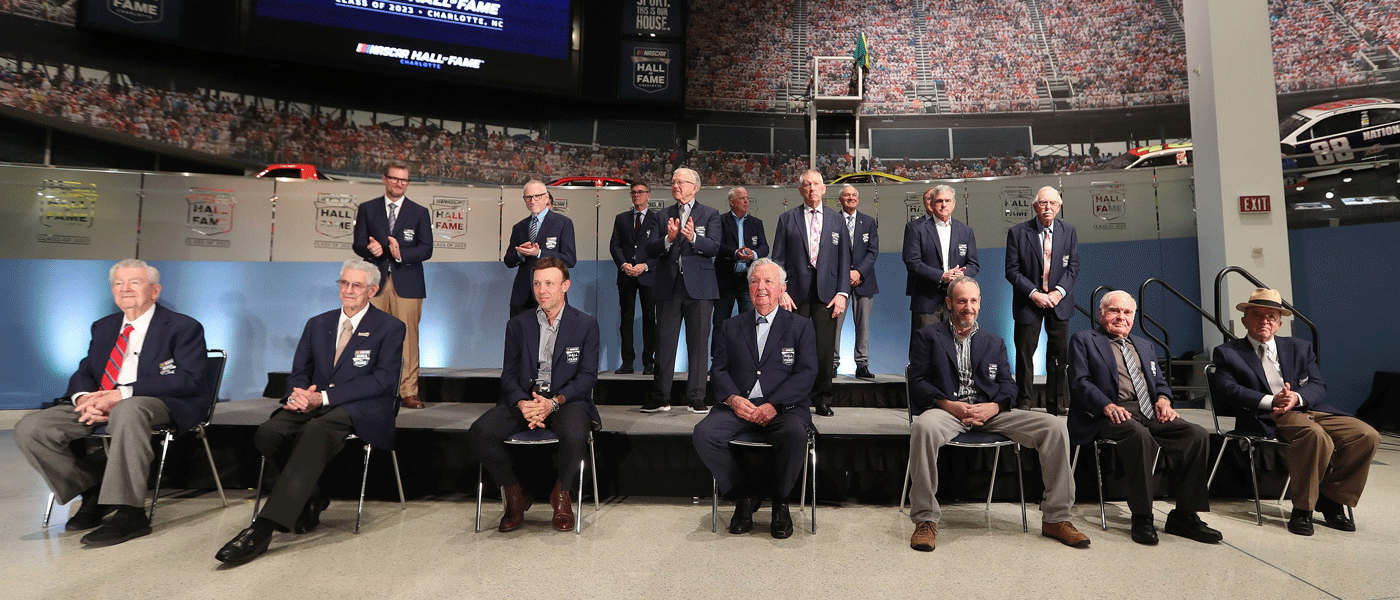 (L-R) NASCAR Hall of Famers (front-row) Bobby Allison, Leonard Wood, Matt Kenseth, Hershel McGriff, Kirk Shelmerdine, Jerry Cook, Jack Roush (back-row) Dale Earnhardt Jr., Mark Martin, Joe Gibbs, Bobby Labonte, Red Farmer, (back-row) Ray Evernham, Dale Jarrett and Ron Hornaday Jr. (Photo by David Jensen/Getty Images)