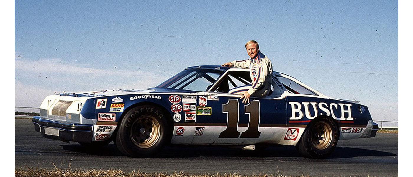 Cale Yarborough sitting in the window of his NASCAR Cup Series car