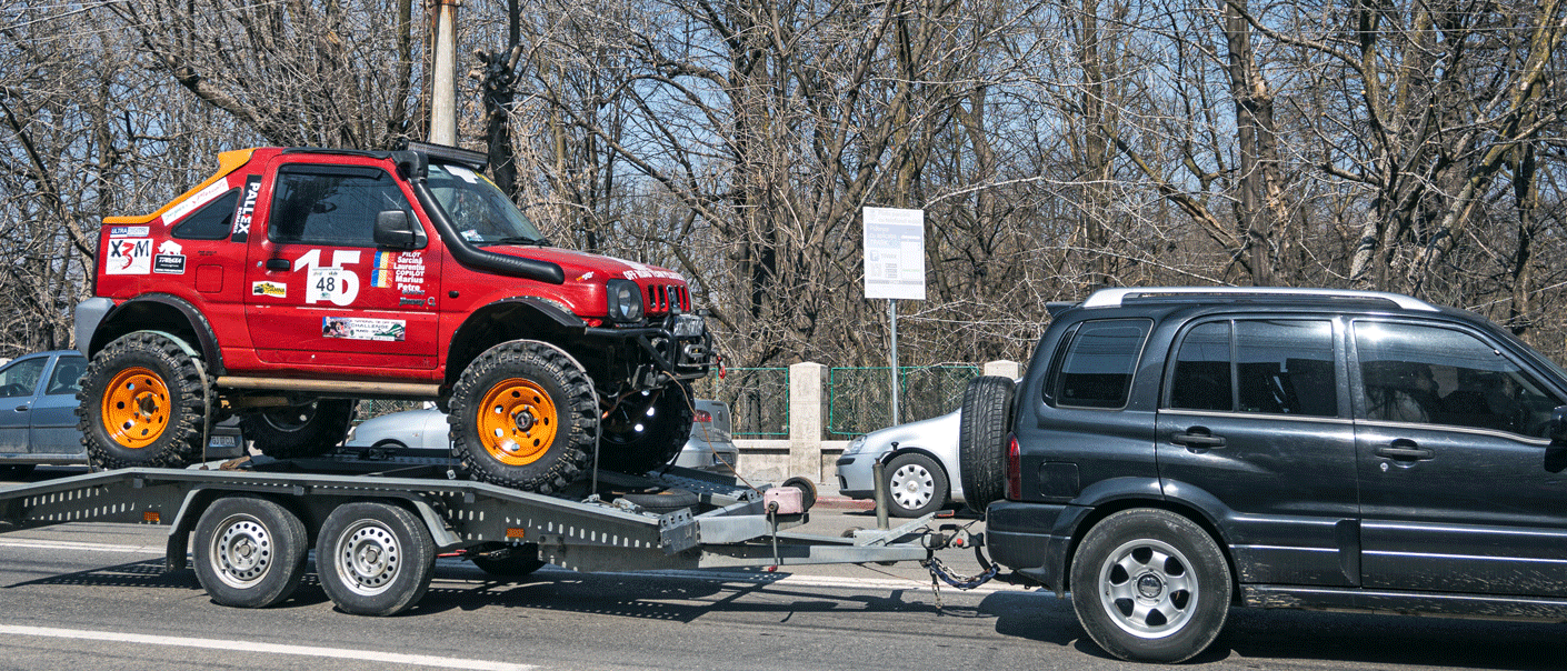 Race car being towed. U.S. Customs Requirements to Bring a Race Car Into the United States