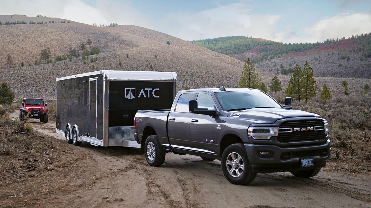 Image of Ram truck hauling a race trailer courtesy of ATC Trailers