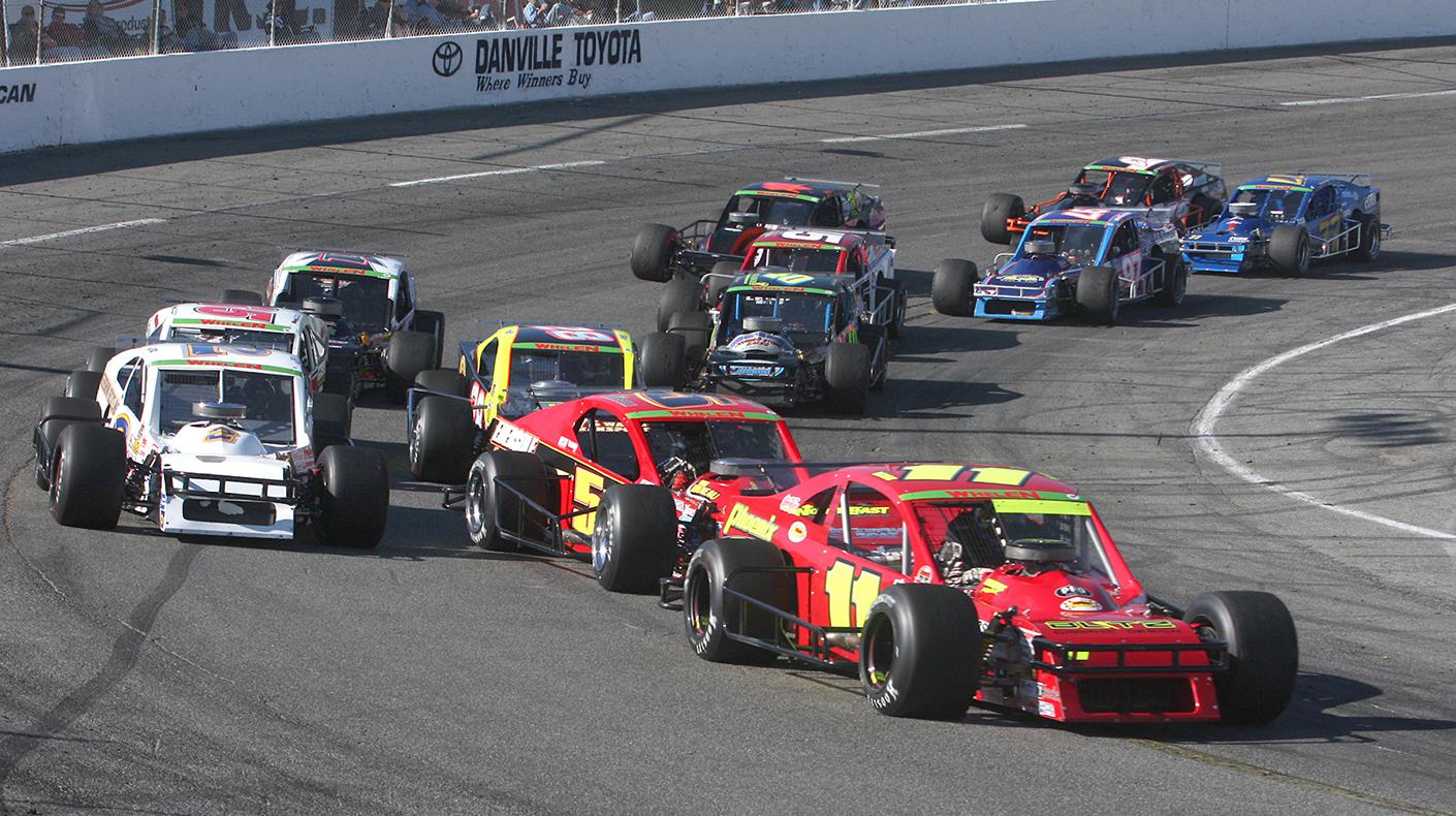 A photo of modified cars racing at South Boston Speedway in Virginia. Photo courtesy of NASCAR.