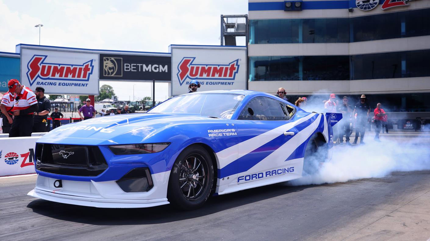 An image of the Mustang Cobra Jet 2200 EV on track.