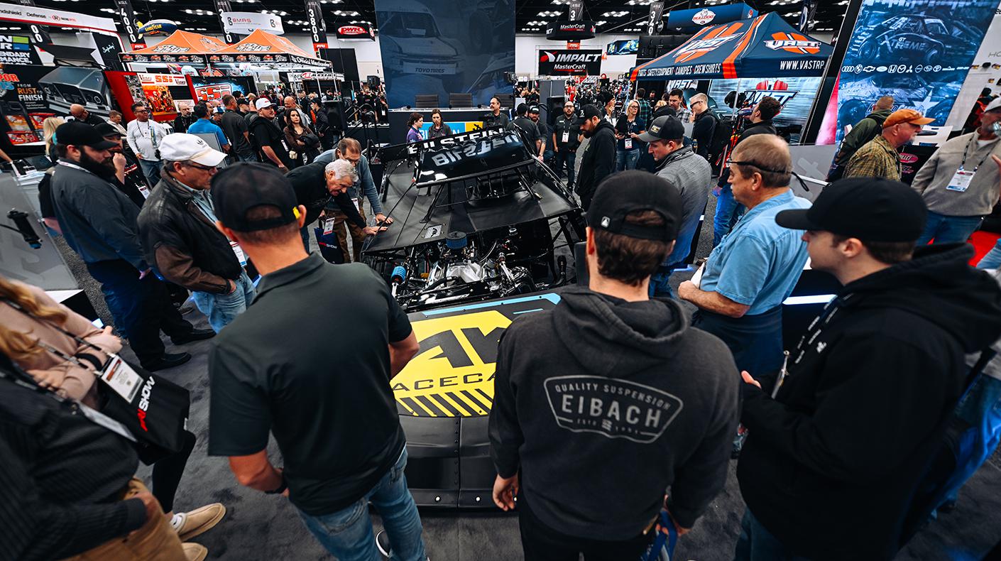 PRI attendees in a booth.