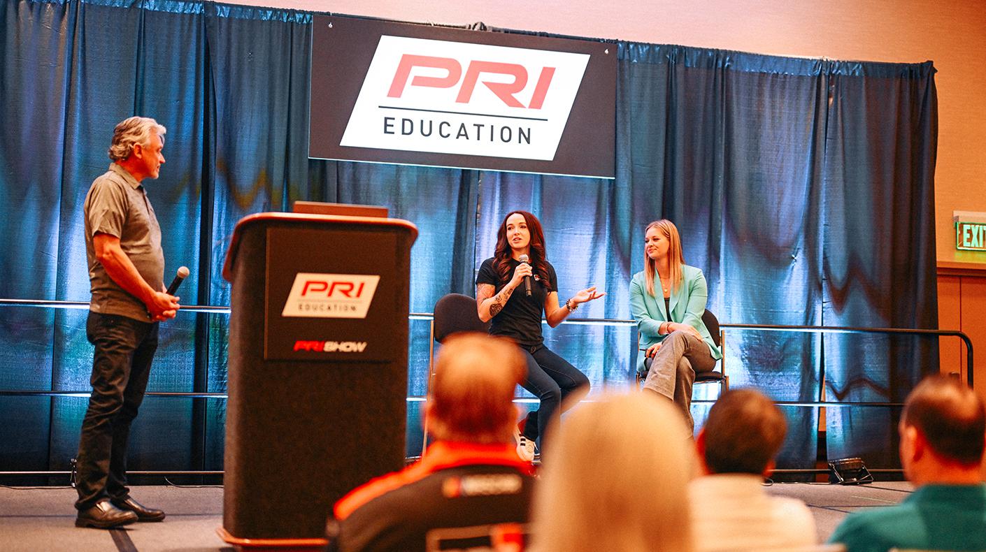 Presenters speaking during a PRI Education seminar.