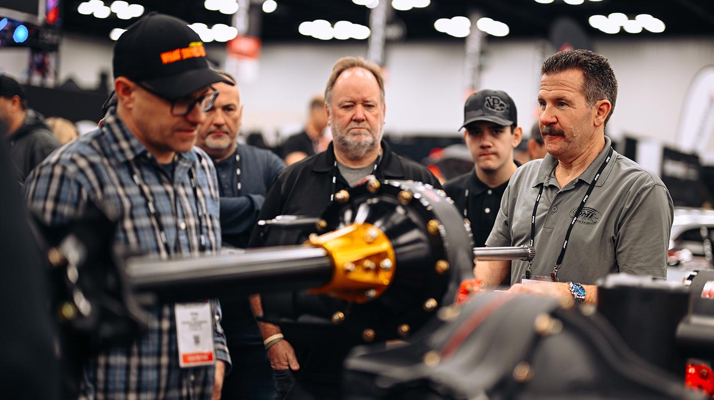 Attendees in a booth at the PRI Show.