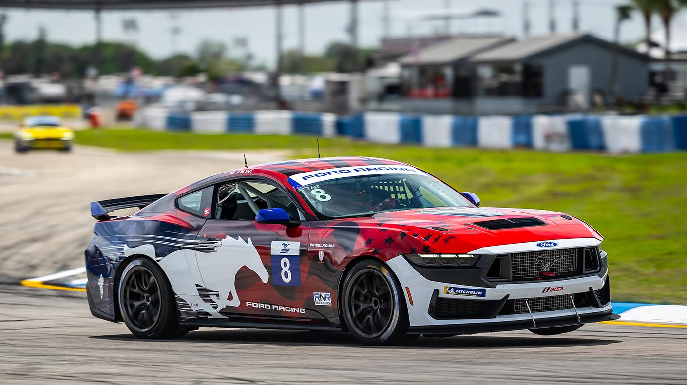 Ford Mustang Challenge car on track.