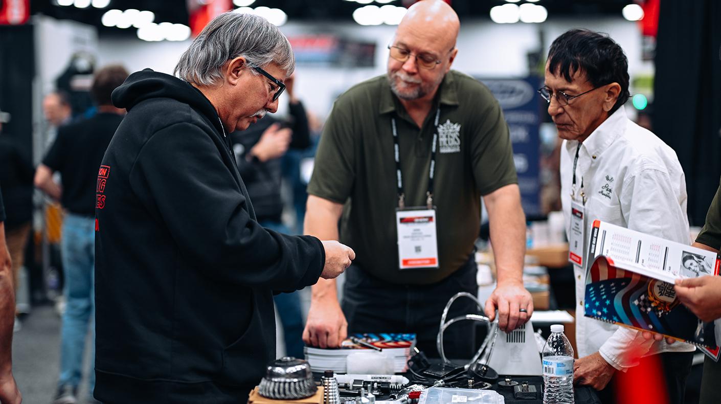 Attendees in a booth at the PRI Show.