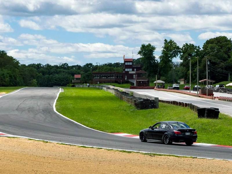 Race car rounding a corner at Summit Point Motorsports Park in West Virginia. Photo courtesy of Summit Point Motorsports Park, Facebook
