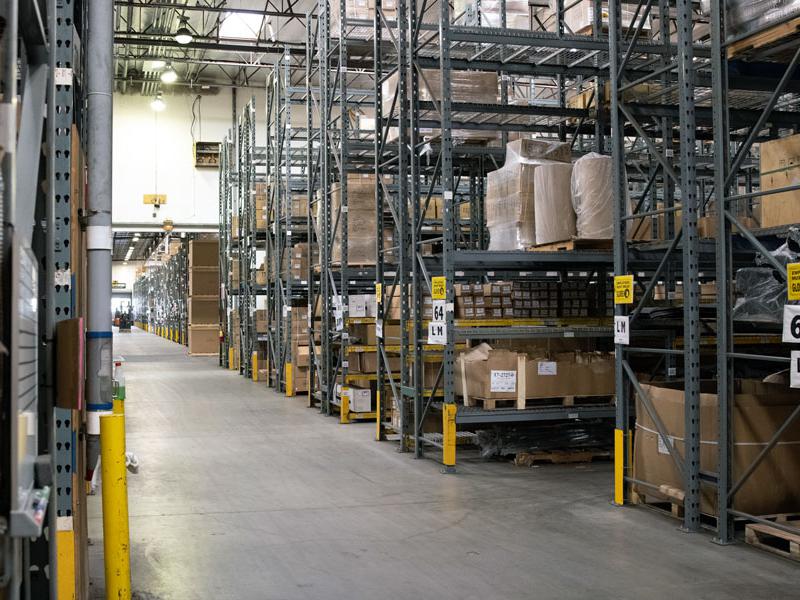Image of EMPI's Anaheim, California warehouse with rows of shelves and boxes