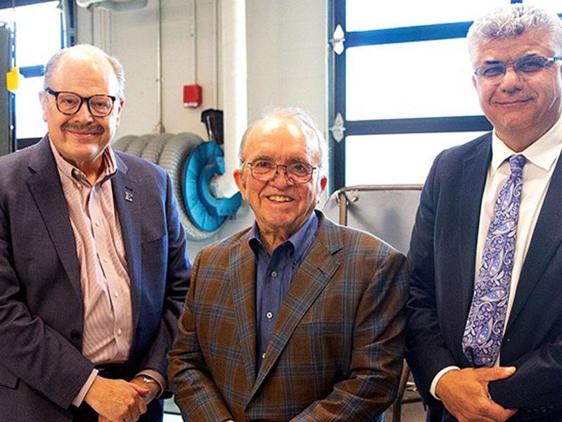 Photo of EMU President Dr. James Smith, Jack E. Roush, and EMU Dean Mohamad Qatu courtesy of EMU