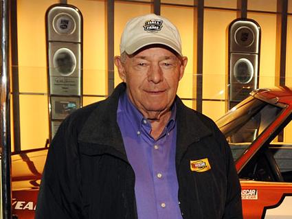 Jack Ingram standing in front of the No. 11 race car in a museum. Photo by Rainier Ehrhardt/NASCAR via Getty Images