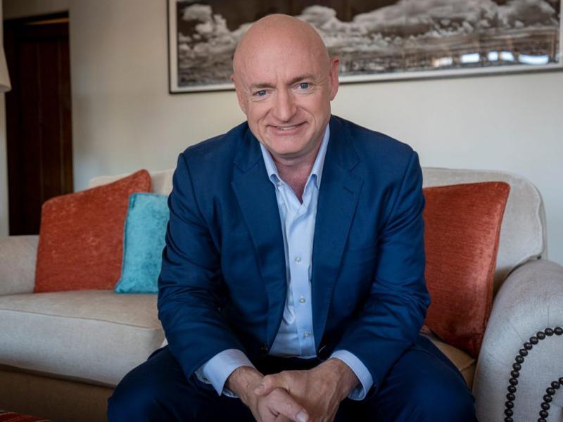 U.S. Senator Mark Kelly (D-AZ) and Save Our RaceCars logo