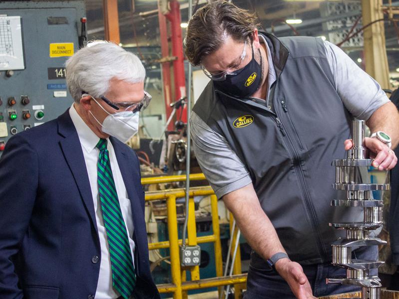 Heath Norton (right), Callies Performance Products vice president, displays a crankshaft to Rep. Bob Latta (R-OH)
