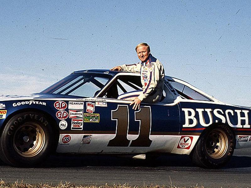 Cale Yarborough sitting in the window of his NASCAR Cup Series car