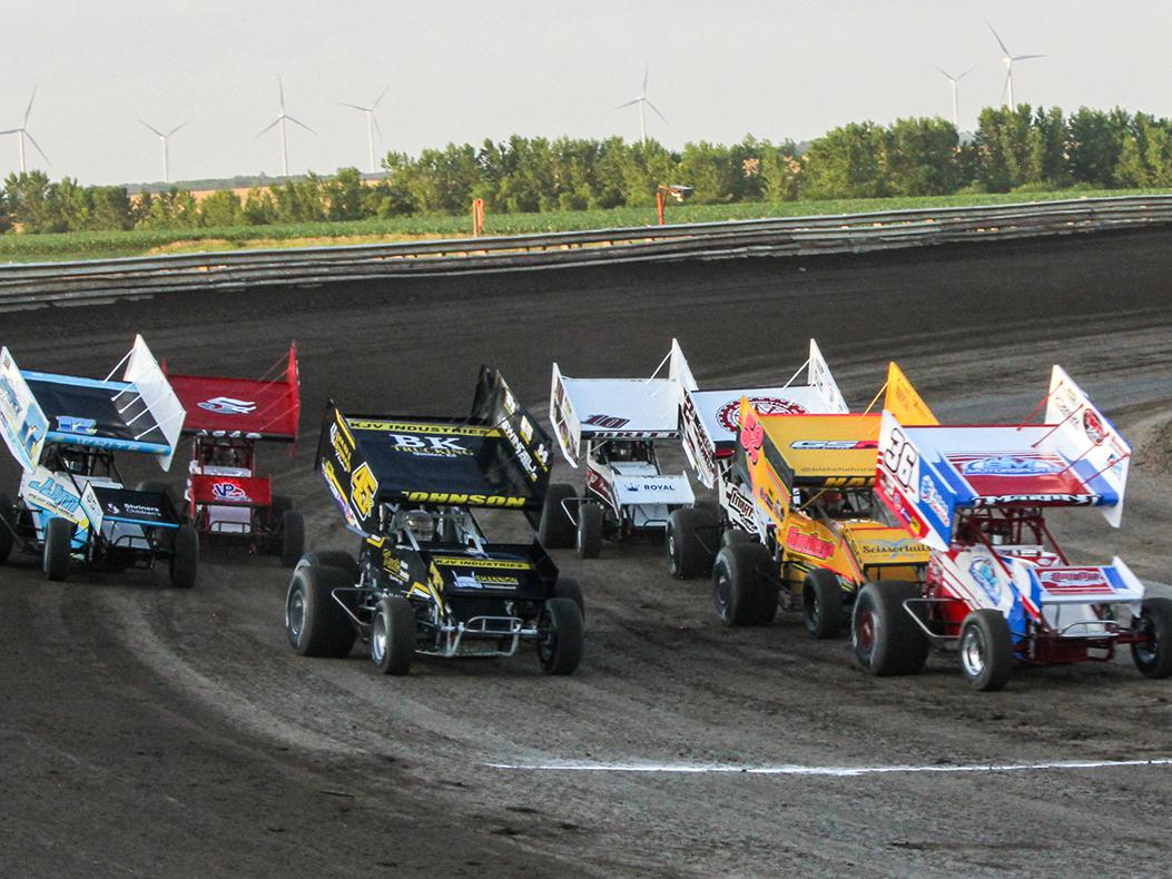 An image of winged Sprint Cars racing at Belleville Speedway in Kansas.