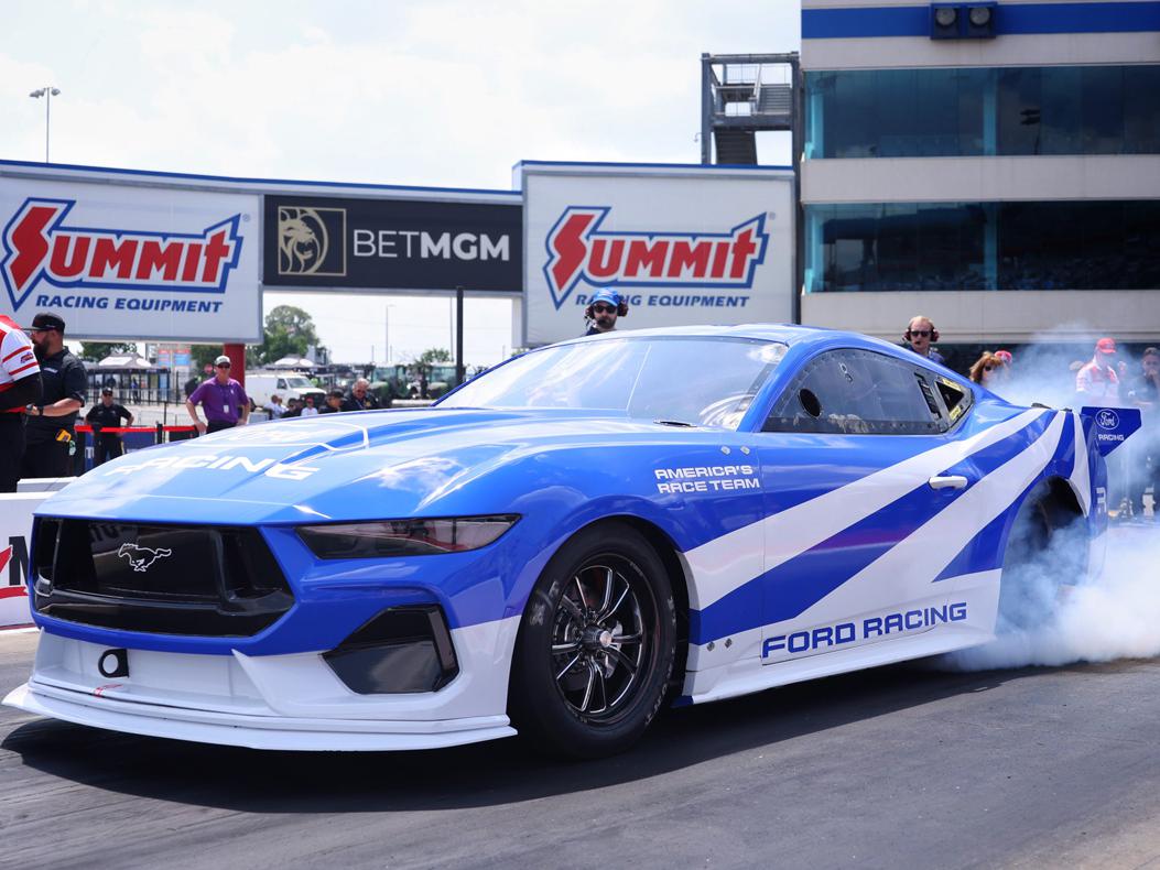 An image of the Mustang Cobra Jet 2200 EV on track.