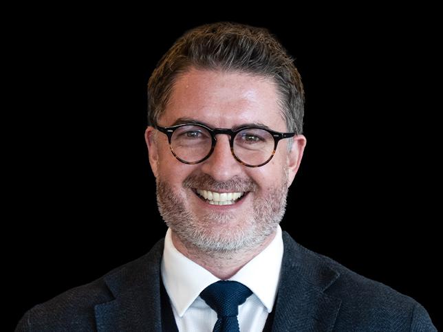 A headshot of new Formula E chief commercial officer Will Brown.