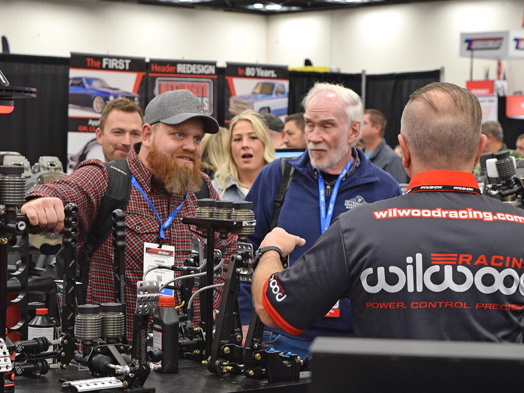 Attendees talking with exhibitors at the PRI Show.