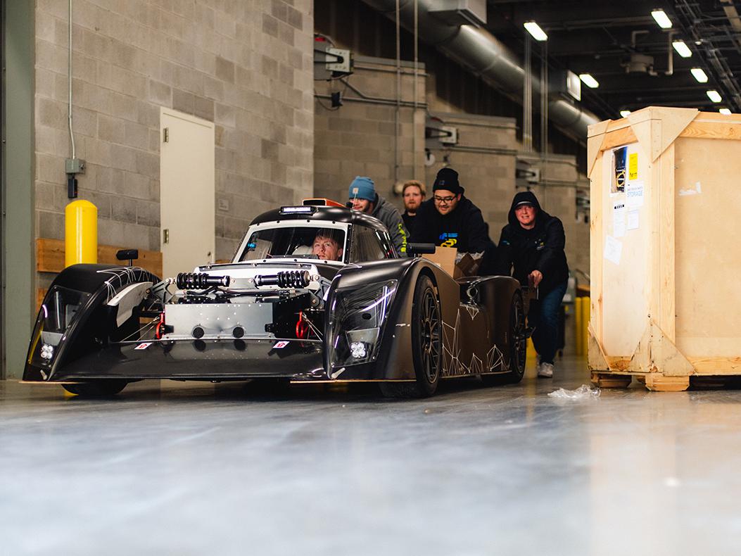 PRI Show exhibitors loading in a vehicle.