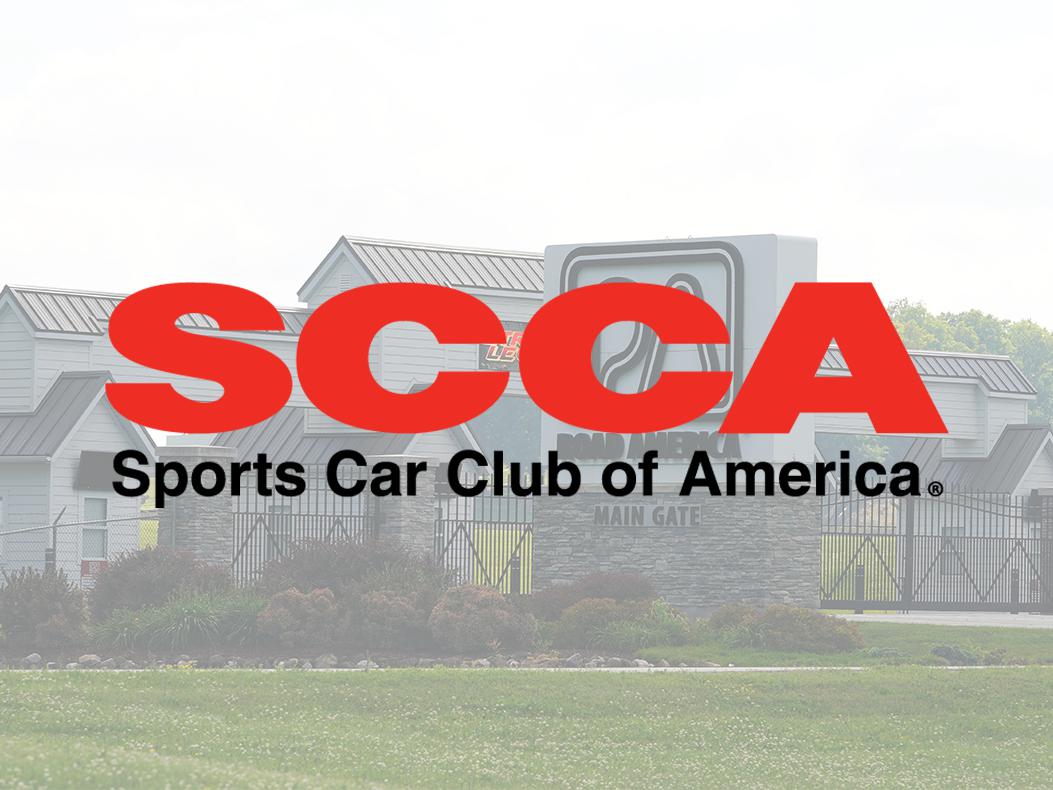 The SCCA logo over a photo of the main gate at Road America.