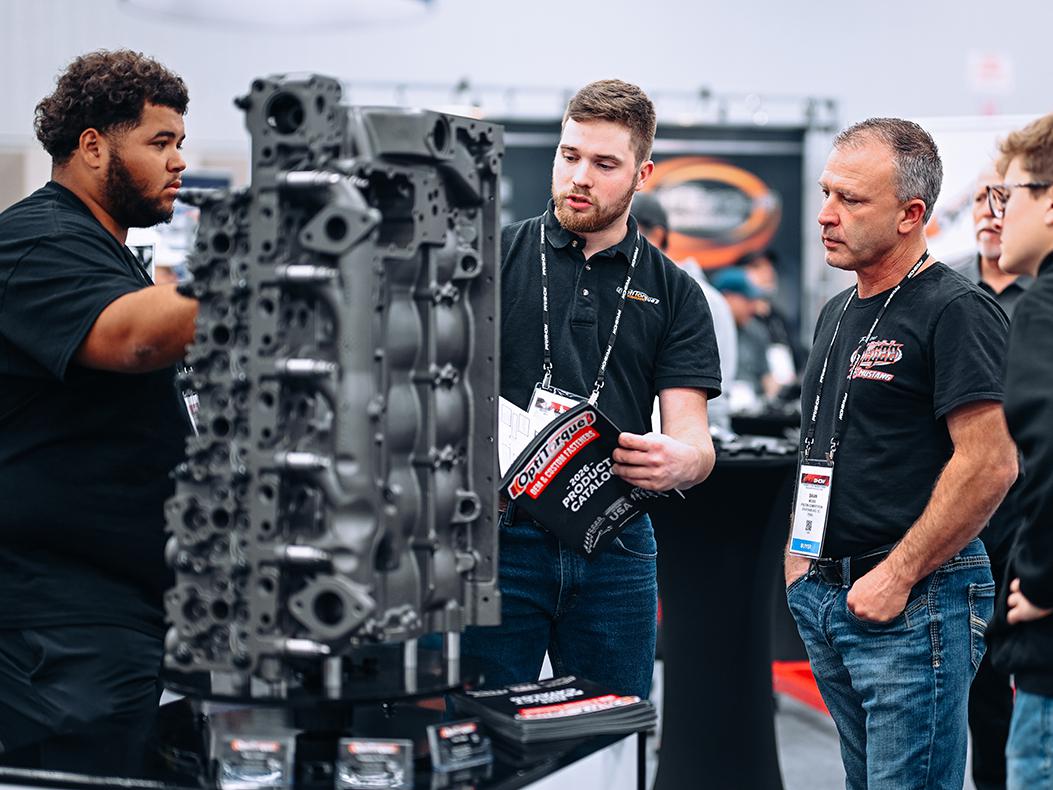 Attendees in a booth at the PRI Show.