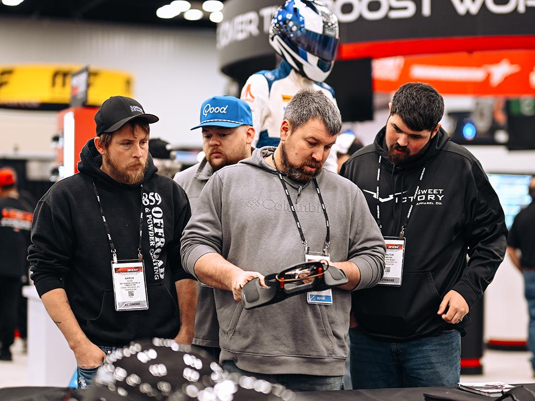 Attendees in a booth at the PRI Show.