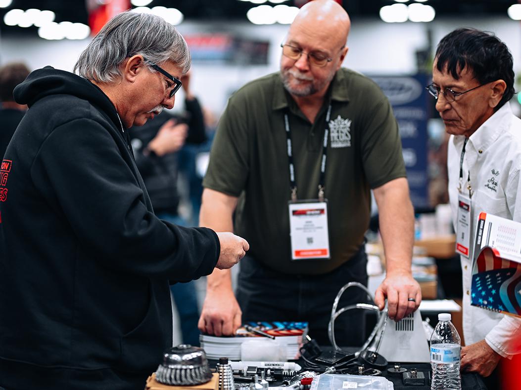Attendees in a booth at the PRI Show.